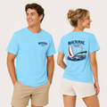 Sky blue Mackinac Boat Race 2026 t-shirt displayed on male and female models with a small front logo and large back print featuring a sailboat and bridge.