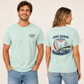 Male and female models wearing mint Port Huron to Mackinac 2026 race shirts, showing the front left chest logo and large sailboat bridge back design.