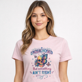 Woman wearing a pink t-shirt with a colorful graphic and text on a white background