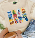 Michigan summer vibes graphic tee with lighthouse, lake, cherries, and bonfire design on neutral shirt